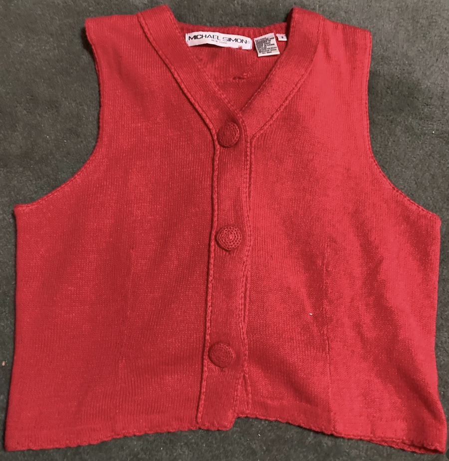 the front of a red button-up vest